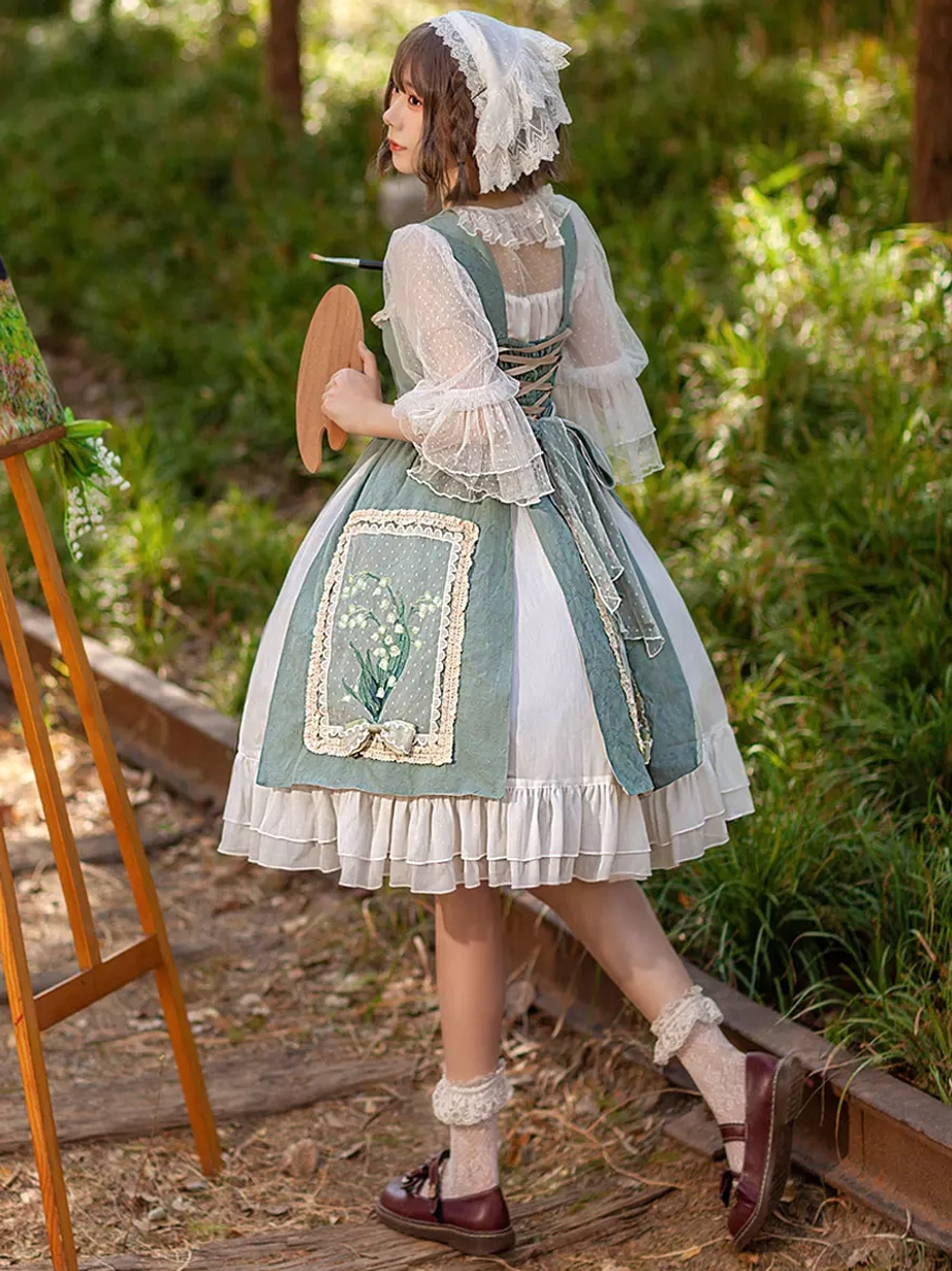 Back three-quarter view of sweet lolita dress near wooden painting stand, displaying lace-up back design and flared sheer sleeves