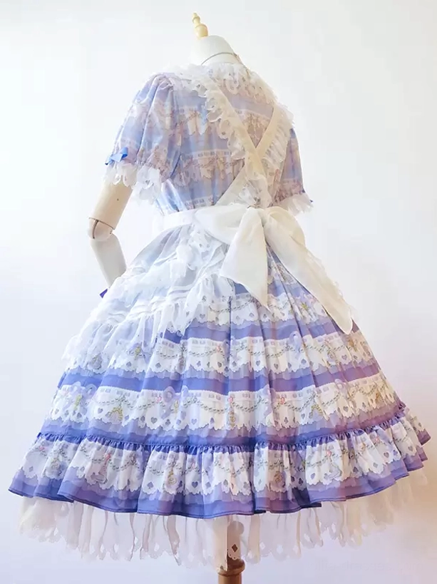 sweet lolita dress back view mannequin display featuring large white back bow, layered printed lace cascading ruffles, detailed ruffle hem construction, and short puff sleeves characteristic of sweet lolita aesthetic