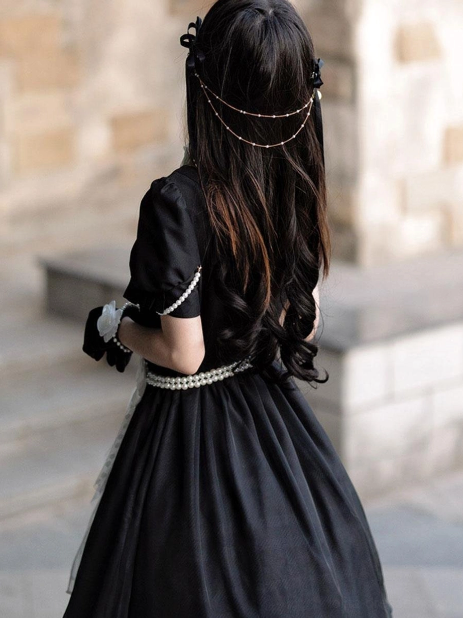 Short-sleeve sweet lolita dress back view showing pearl waist belt puff sleeve white trim and hair chain accessory