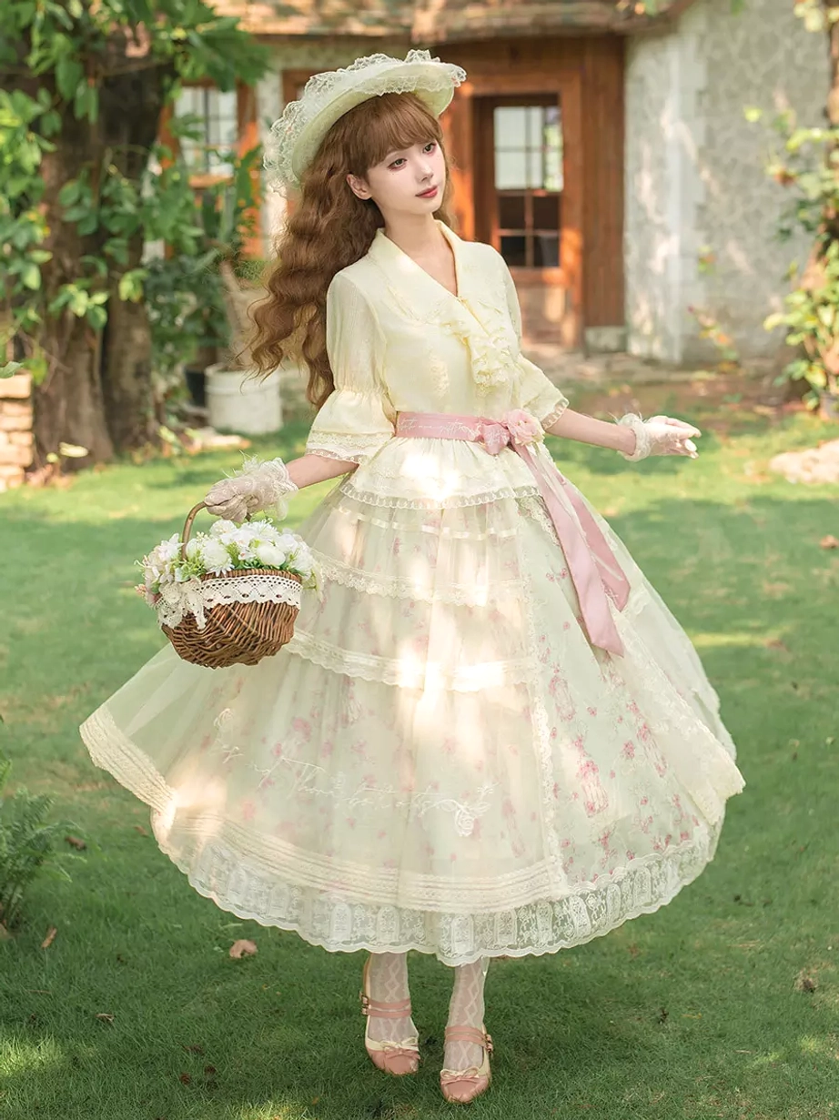 Sweet lolita dress rear three quarter angle model cream floral print pink bow sash tiered lace skirt outdoor
