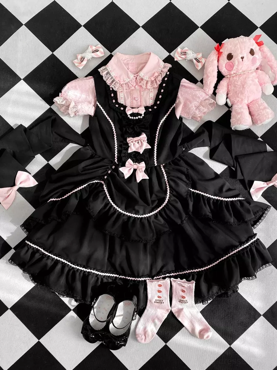 Sweet Lolita jumper dress flat lay display with inner blouse, socks, shoes, matching bow and lace trim accessories