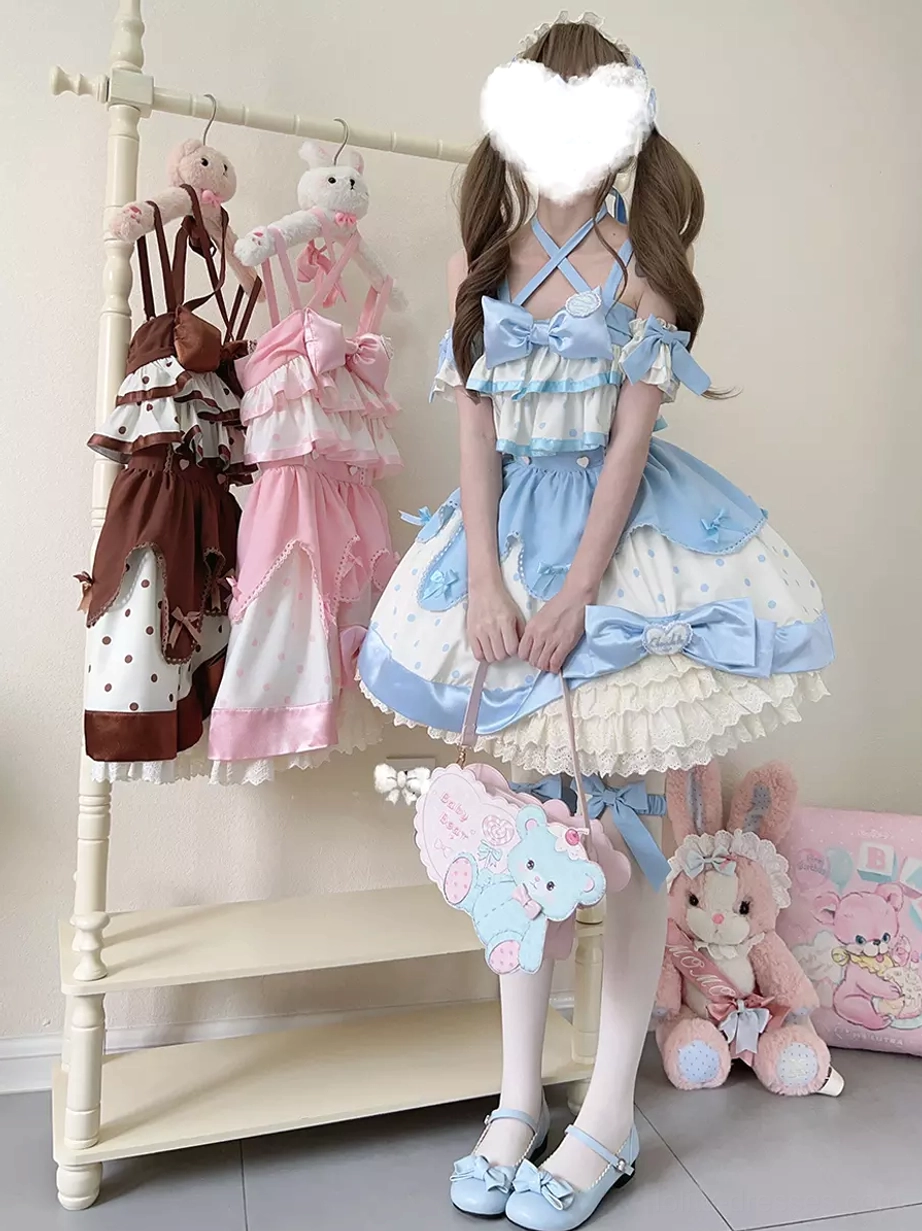 Sweet lolita jumper dress with halter off-shoulder design in blue and white, paired with plush handbag and twin-tailed hairstyle