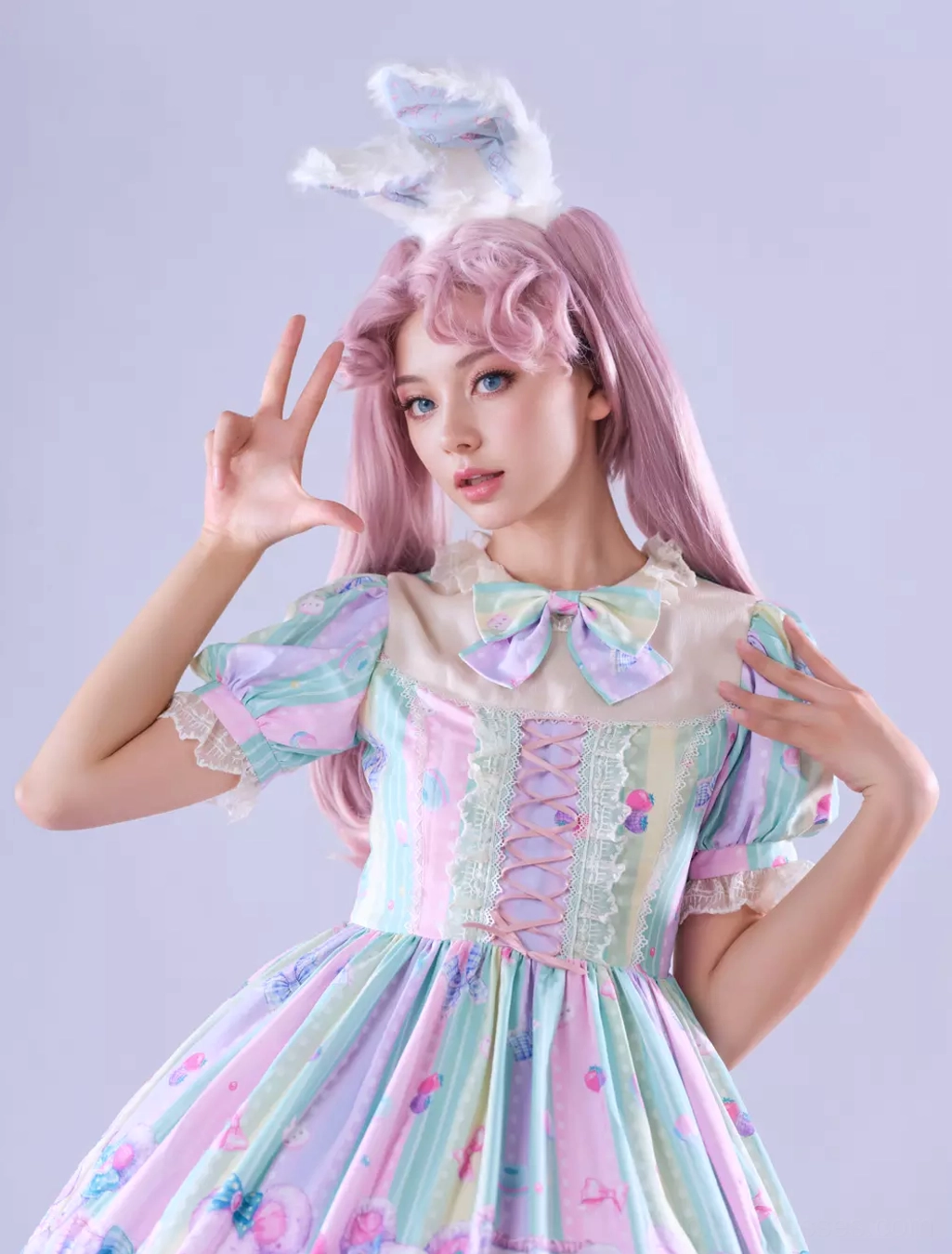 Sweet lolita dress pastel colorway detail showing chiffon fabric texture, lace-up bodice construction, ruffled embellishments, and overall dress construction quality