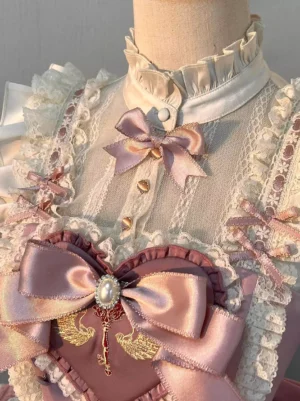 Sweet Lolita dress collar and upper chest detail featuring ruffled stand collar, mesh lace trims, pink satin bows and heart embroidery close-up view
