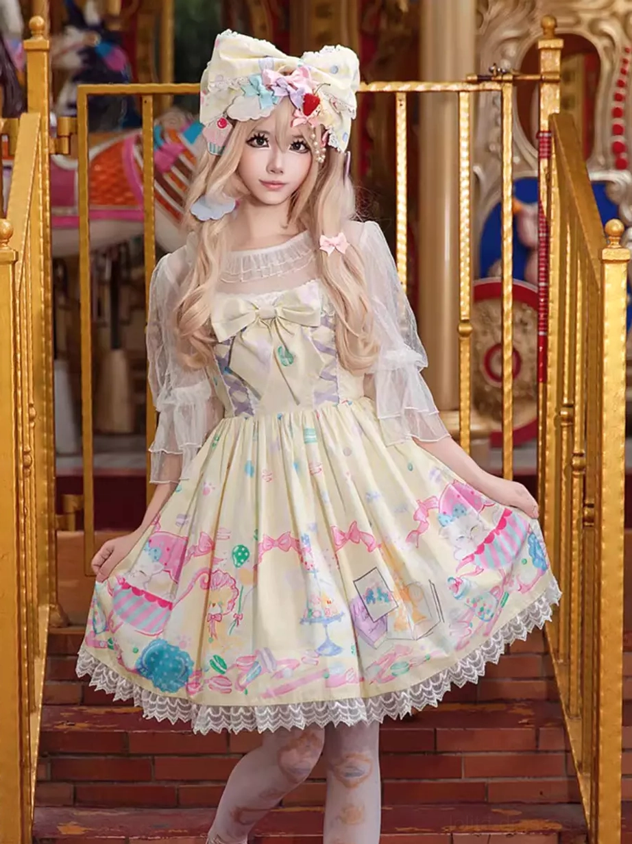 Sweet lolita sleeveless dress detail shot showcasing lace embellishment quality, bow construction, pastel cartoon dessert print pattern, and structured hem finish
