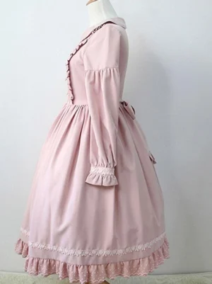 Dusty rose lolita one-piece dress left side view on dress form showing ruffled cuffs pleated skirt lace-trimmed hem
