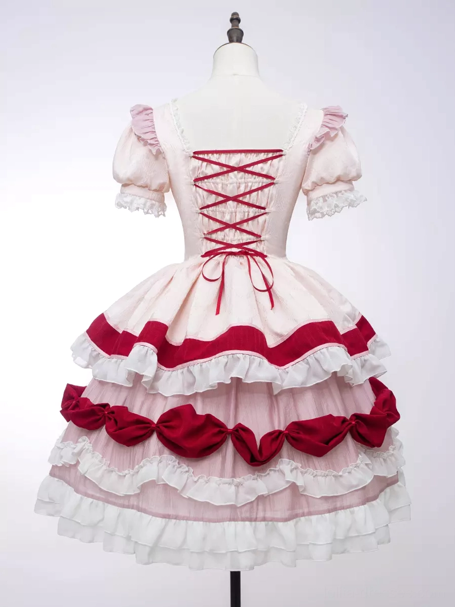 Sweet Lolita OP dress embellishment detail close-up showcasing lace trim work, bow placements, ruffle construction, and fabric quality of the one-piece dress