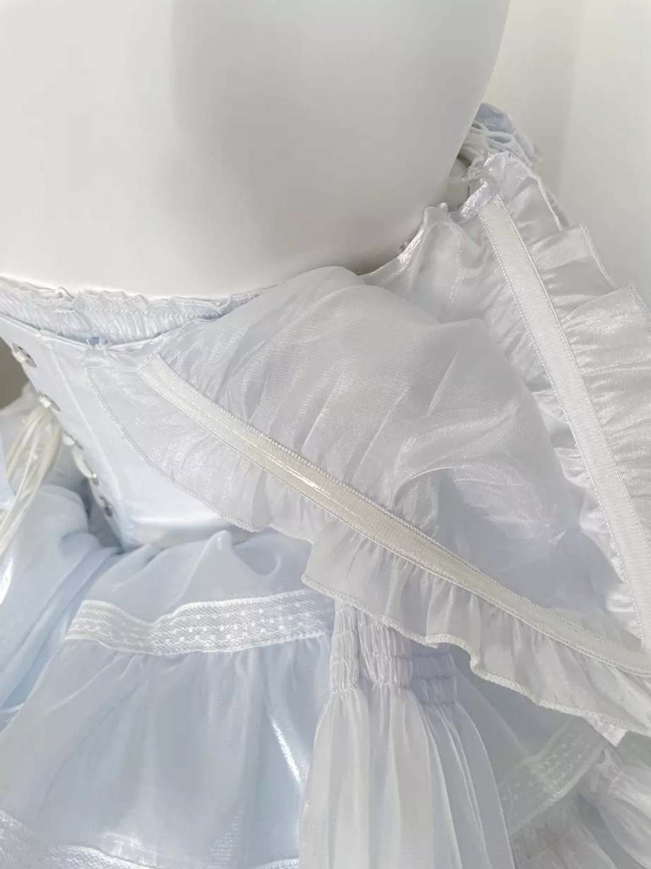 Sweet lolita dress flat lay display with coordinating accessories including rabbit ear headpiece, bow choker, and complete fairy-tale ensemble setup