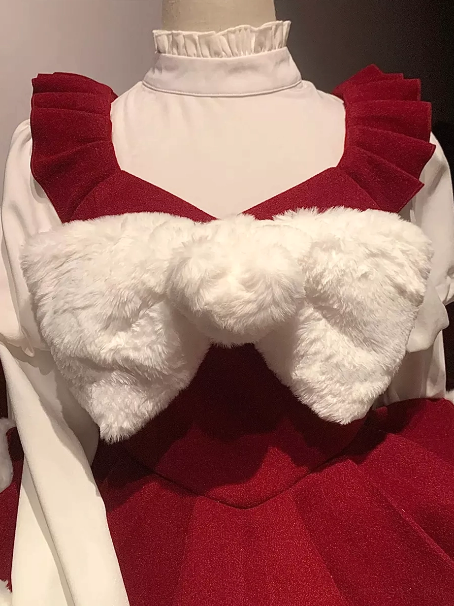 Oversized fluffy bow and ruffled straps detail of Christmas sweet lolita dress with white turtleneck inner top close-up view