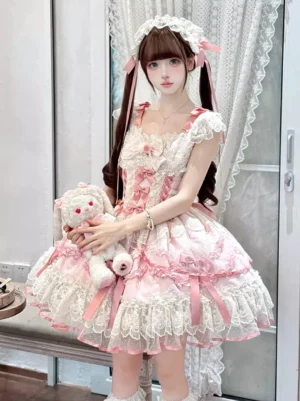 Full-body front view of sweet pink ballet-inspired lolita dress with corset bodice, multi-layered lace skirt, pink ribbon details, and matching lace headpiece on model