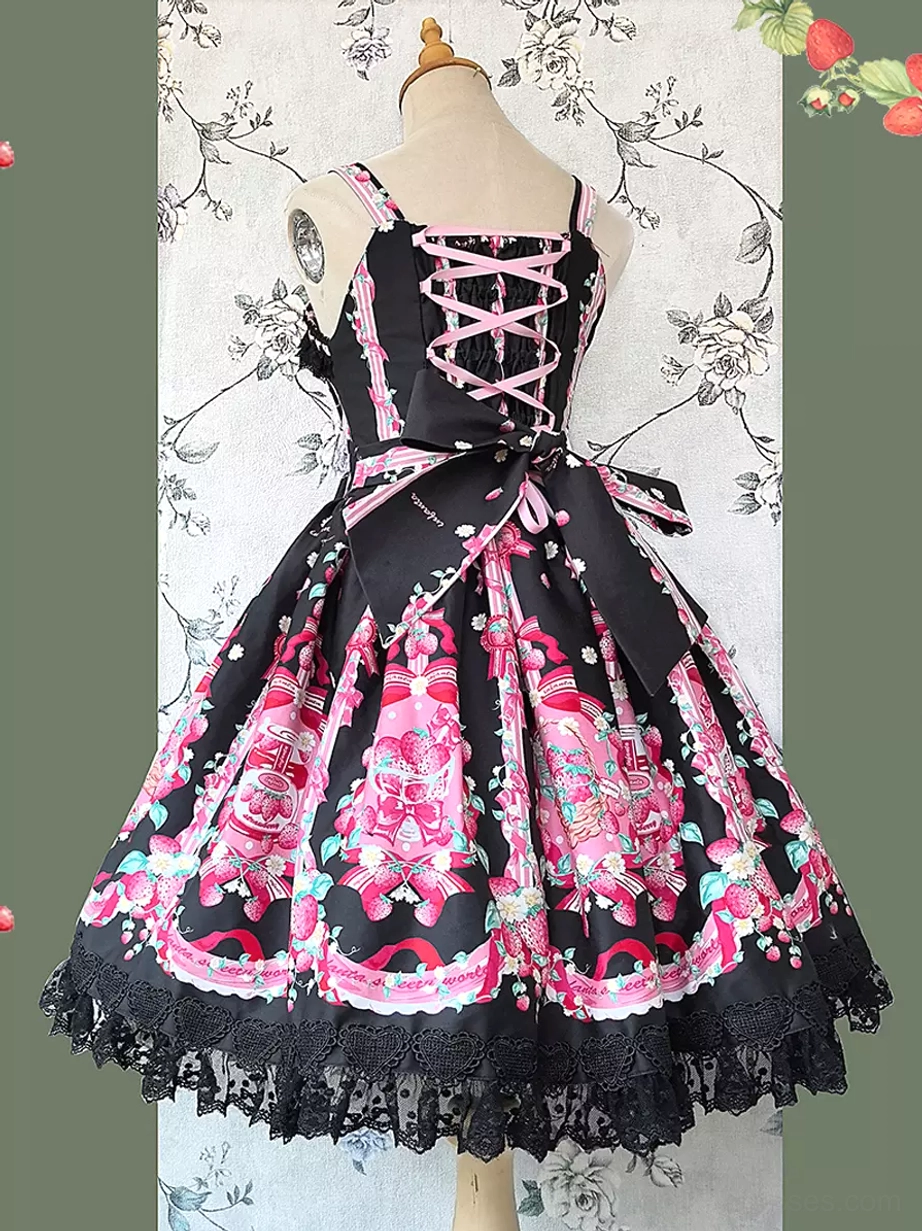 Sweet lolita dress back view showing lace-up back corset design, black waist bow, black lace hem trim, matching pink floral prints on dress form with floral wallpaper backdrop
