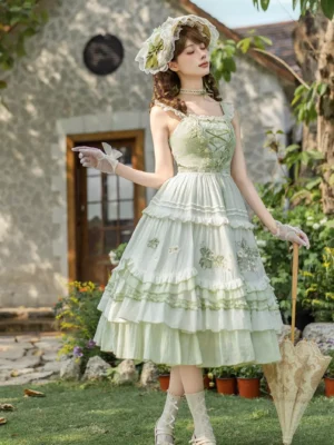 Lolita dress side profile showing lace-up corset bodice ruffled shoulder straps and layered tiered hem in sage green outdoor cottage yard