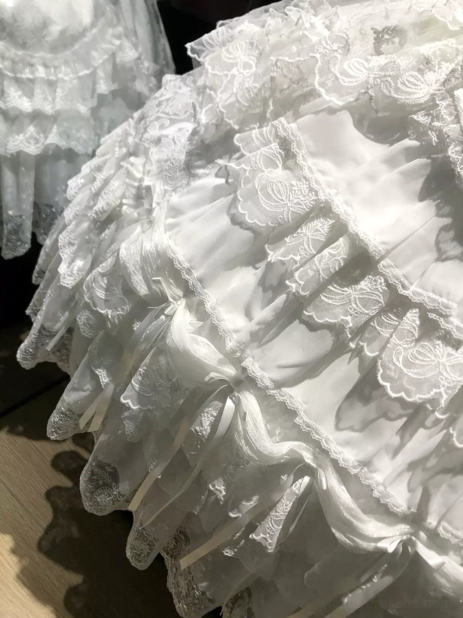Close-up detail of multi-layered lace ruffles and scalloped hem construction on sweet lolita dress skirt