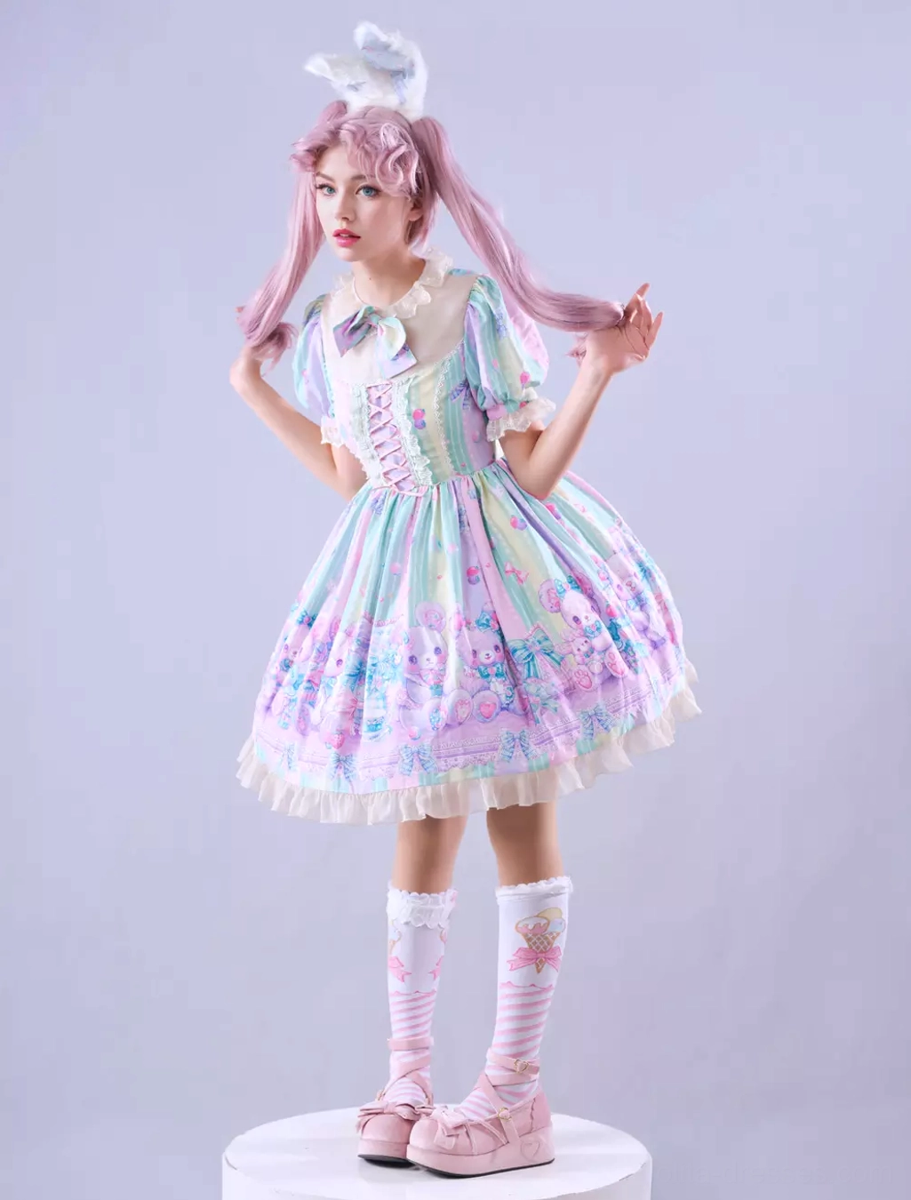 Sweet lolita dress side three-quarter view featuring light purple colorway, complete outfit styling with heart knee socks, pink platform shoes, and bunny ear headpiece on studio background