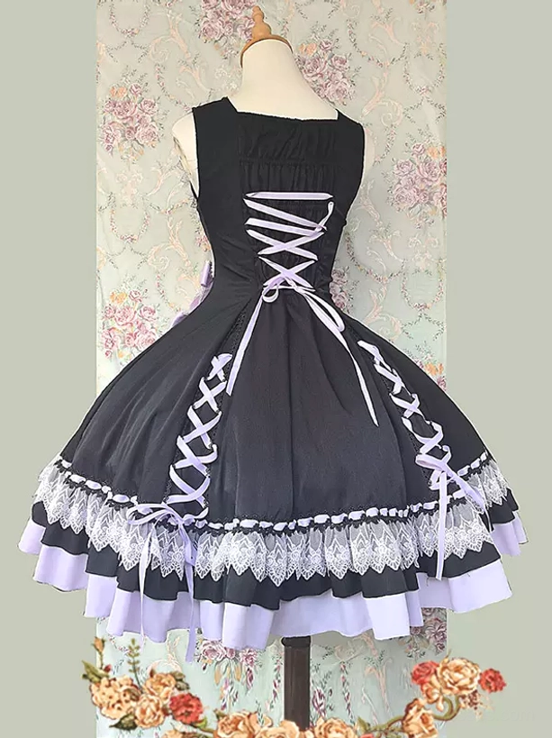 Back display of lilac sweet lolita dress showing back lace-up construction, side lace-up details, and cascading layered ruffled hem on dress form