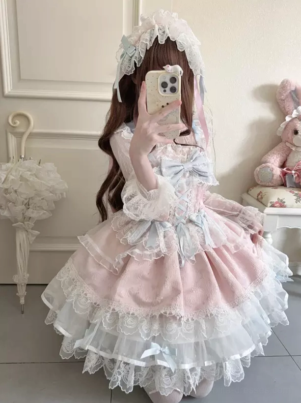 Sweet lolita dress with long sleeves seated view pink light blue front bow ruffled lace hem plush decor