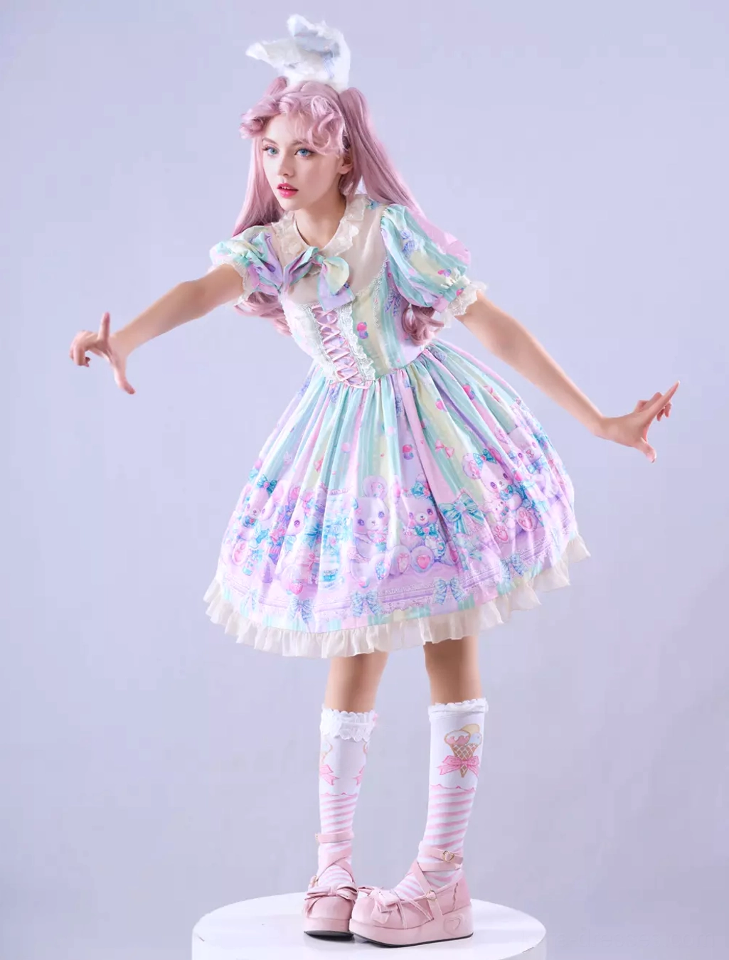 Sweet lolita dress neckline and upper bodice detail showing coordinating neck bow, lace trim, ruffled puff sleeves, and bodice construction