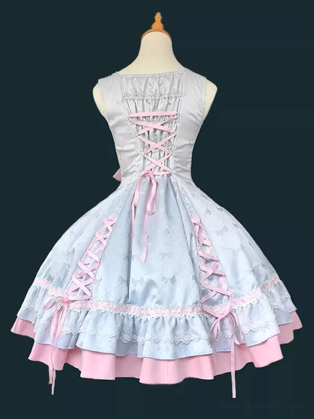 Back view of sweet lolita dress showing back lace-up construction and light blue pink color scheme, sleeveless jumper dress rear display