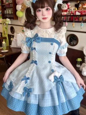 Sweet lolita coordinate showing detailed ruffled sleeves, blue bow decorations, polka dot fabric texture, and lace embellishments - front medium shot indoor shop setting