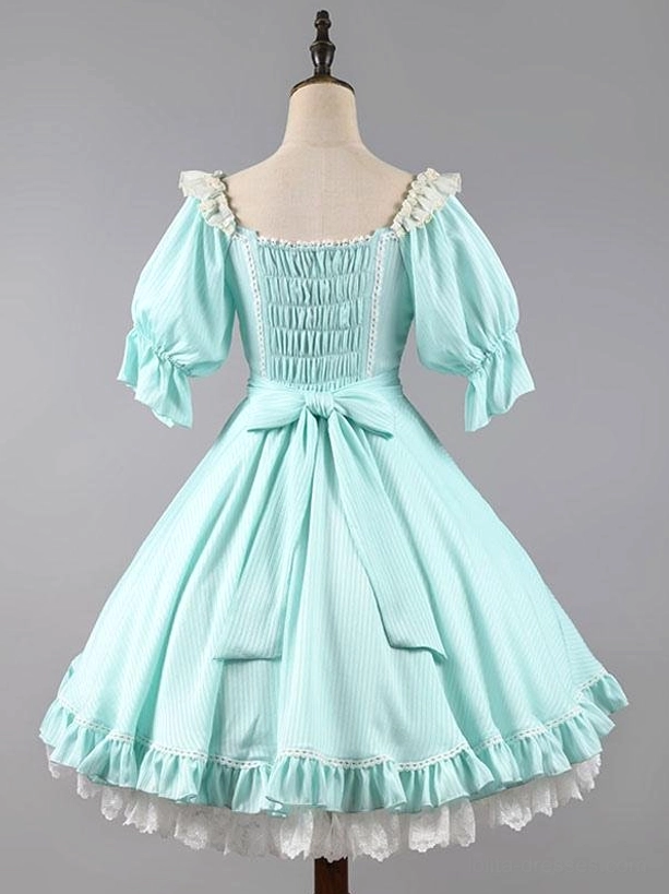 Sweet lolita dress detail shot highlighting puff sleeves lace trim and front bow decoration