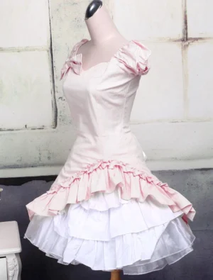Pink ruffle lolita dress three-quarter front view fitted bodice layered white tulle underskirt romantic silhouette