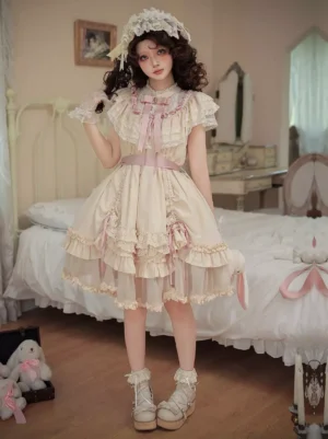 Sweet lolita short dress straight full-body front view model wearing ecru dress with coordinating lace bonnet headwear in bedroom backdrop, showing layered tulle skirt construction