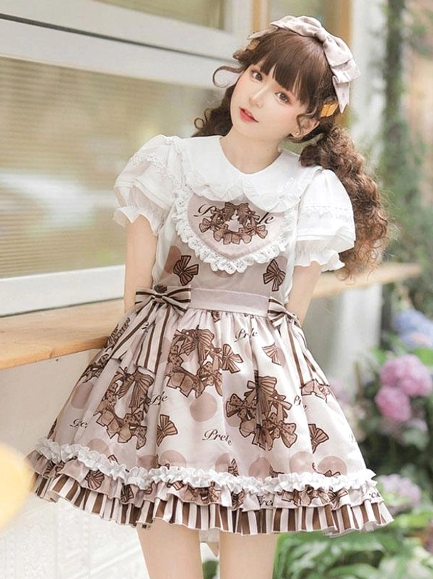 Sweet lolita dress set left three-quarter view showing Peter Pan collar inner top and heart-shaped lace bodice worn by model with twin curly brown hair