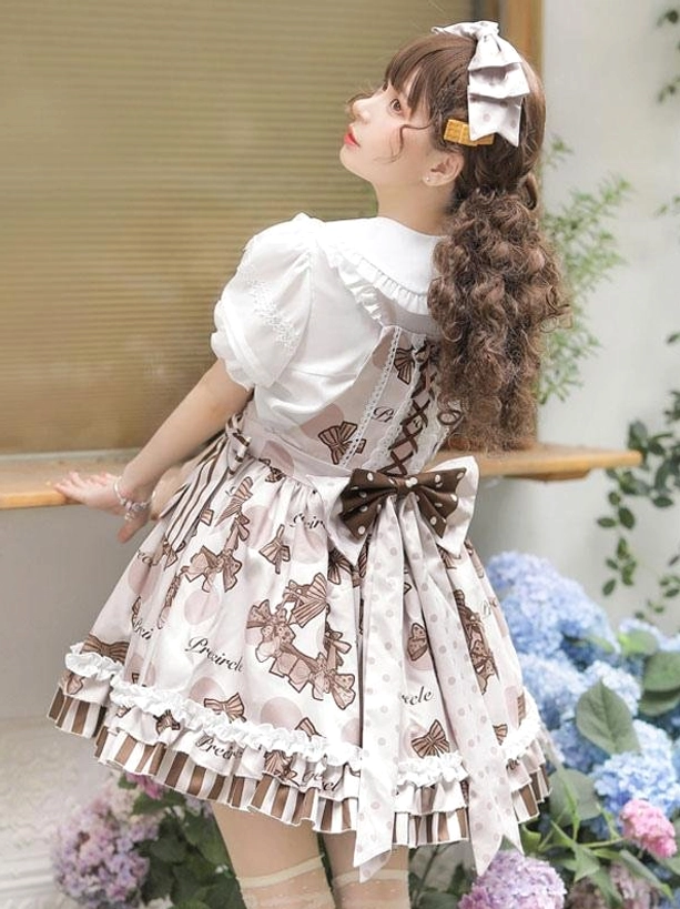 Sweet lolita dress set right side-back view with model looking upwards, featuring long striped detachable sash, large back bow, and ruffled short sleeves