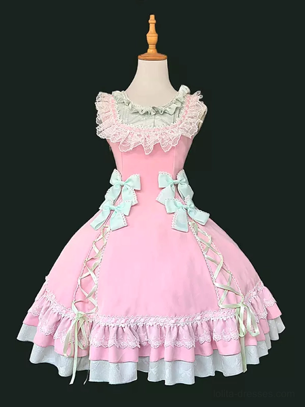 Side-back angle of sweet lolita dress showing lace-up construction, sleeveless design, and voluminous layered ruffled hem on mannequin
