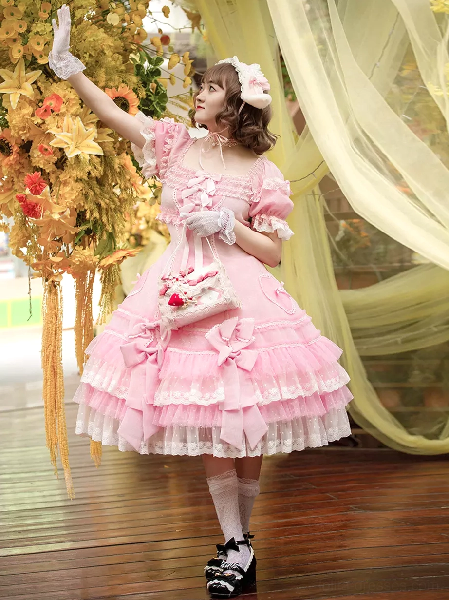 Sweet Lolita dress side three-quarter view showing square neckline lace trim and tiered ruffled skirt details