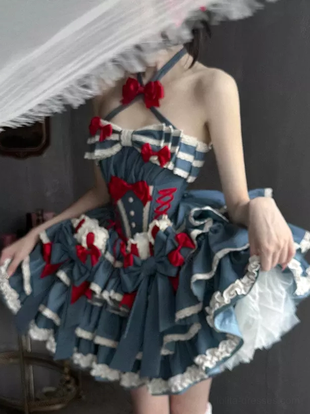 Side profile of sweet lolita dress showing halter straps multi-layer ruffled skirt and red bow trim details