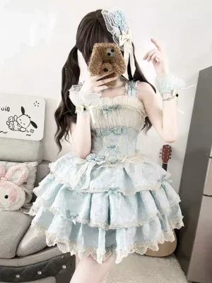 Light sky blue lolita dress side profile view showcasing corset-style bodice, layered tulle skirt, and matching wrist cuffs with mini bow details