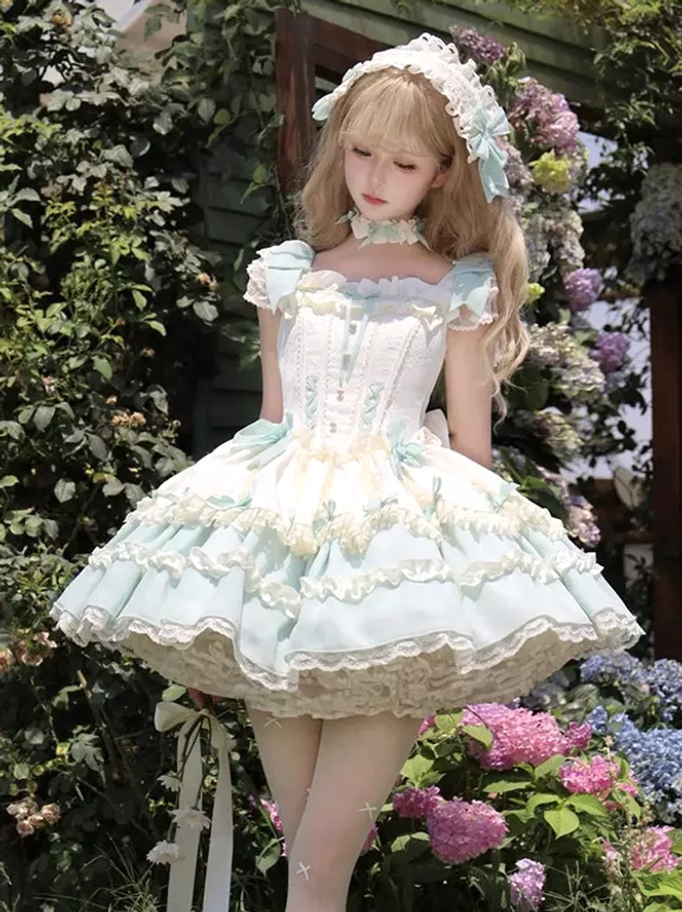 Square neckline sweet lolita dress mint green off-white featuring ruffled shoulder straps, two-tone layered lace skirt, coordinated hair accessory and choker, full-body front view in courtyard with flowers