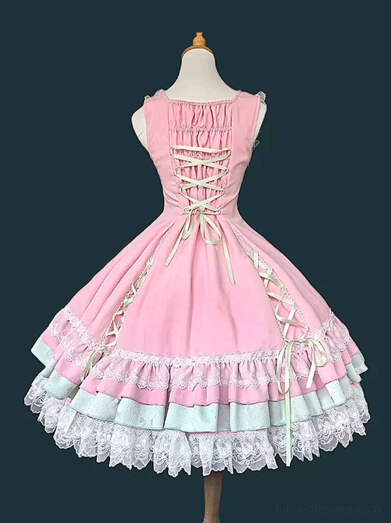 Sweet lolita jumper dress styled detail view showing sleeveless neckline with lace collar, decorative elements, and layered ruffled hem construction