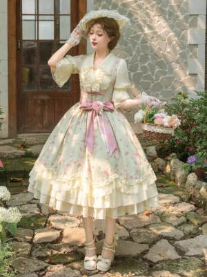 Three-quarter front view of sweet lolita outfit featuring flare sleeve blouse with ruffled lace neckline and pink waist bow coordination