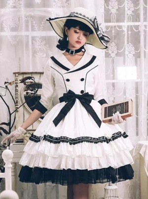 Black and white sweet lolita dress with tiered ruffles and three-quarter length sleeves, front view in vintage room setting, showcasing the voluminous skirt silhouette and refined waistline