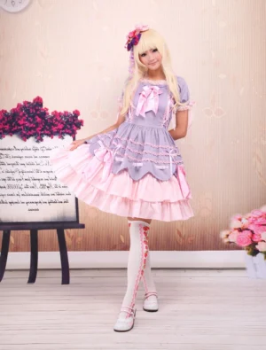 Sweet lolita one-piece dress three-quarter side view showing layered skirt construction lace trimmed socks and ruffled collar