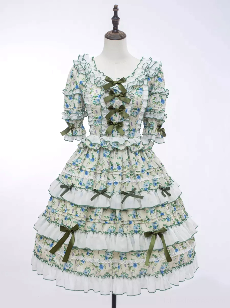 Floral sweet lolita dress yellow base blue flowers tiered construction emerald ribbon accents detailed product view