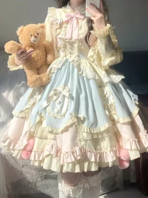 two-tone pastel yellow light blue sweet lolita dress tiered ruffled skirt front bow details fuzzy pink pom-poms teddy bear