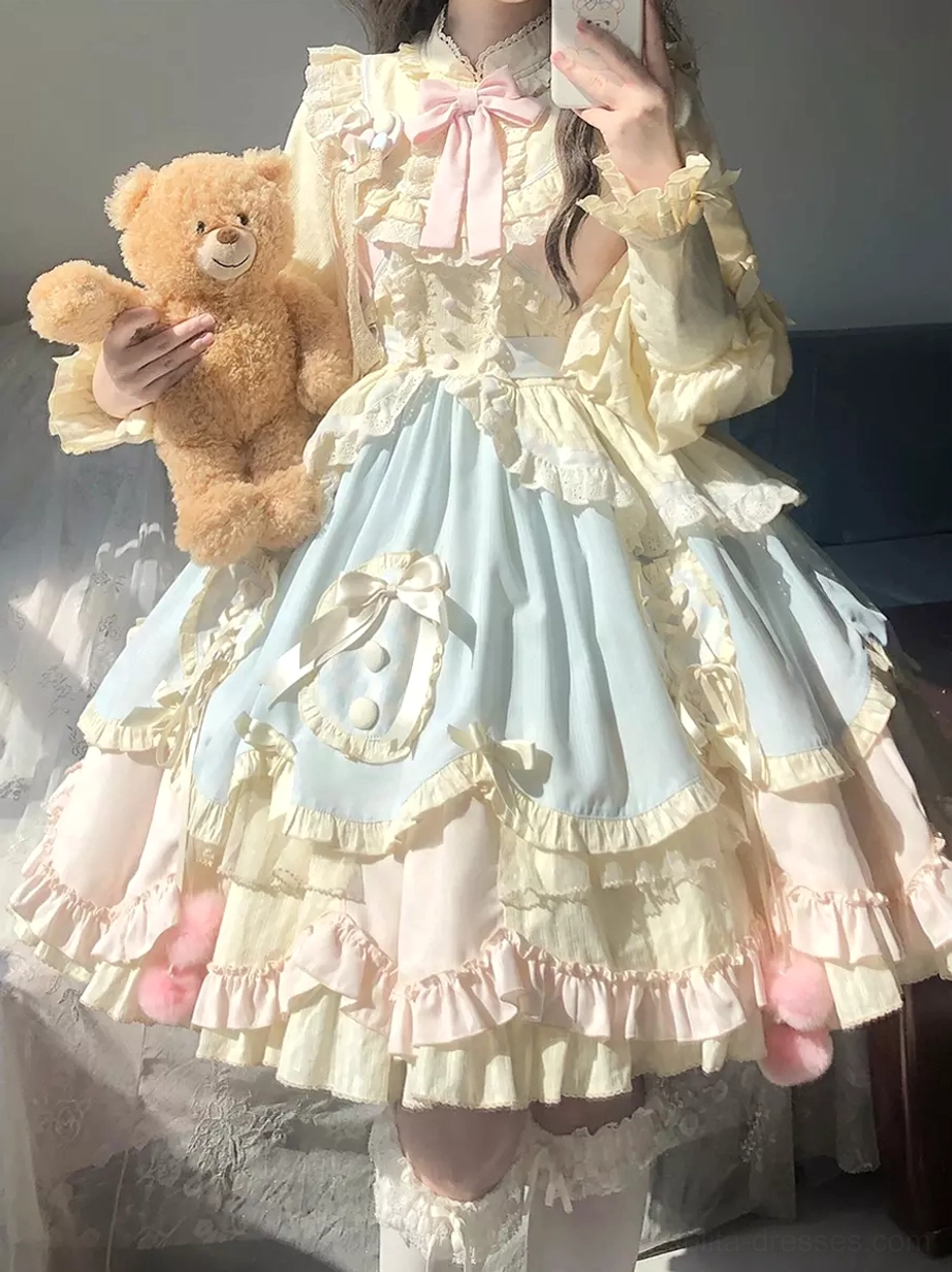 two-tone pastel yellow light blue sweet lolita dress tiered ruffled skirt front bow details fuzzy pink pom-poms teddy bear