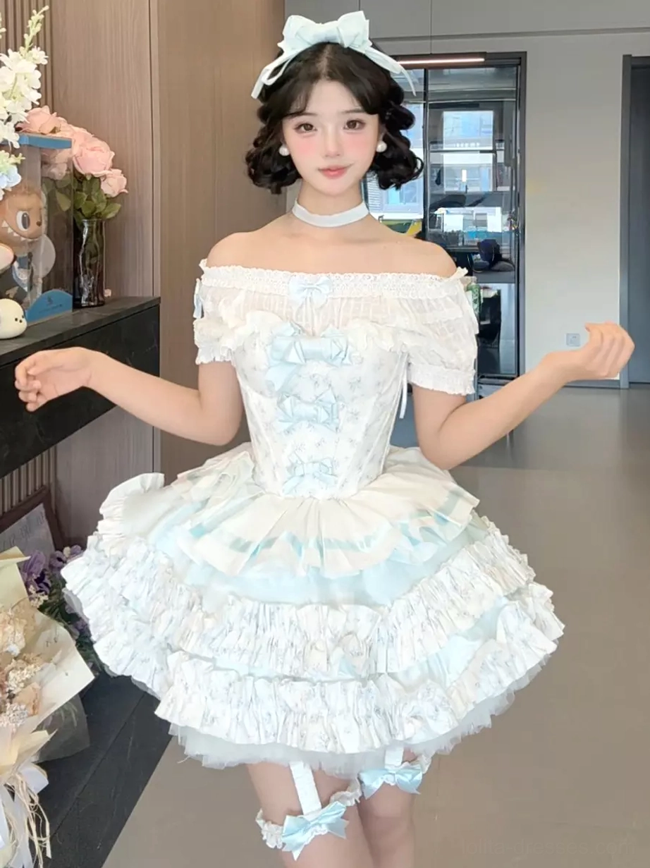 Sweet lolita fairy dress full pose on model showing bow hair accessory leg bow garter ruffled skirt tiered tulle layers romantic styling