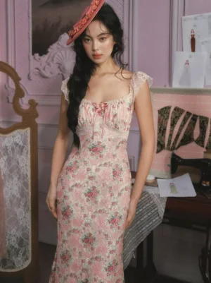 Sweet lolita pink fairy dress close-up front view showing lace ruffle cap sleeves square neckline with bow detail ruched bust design