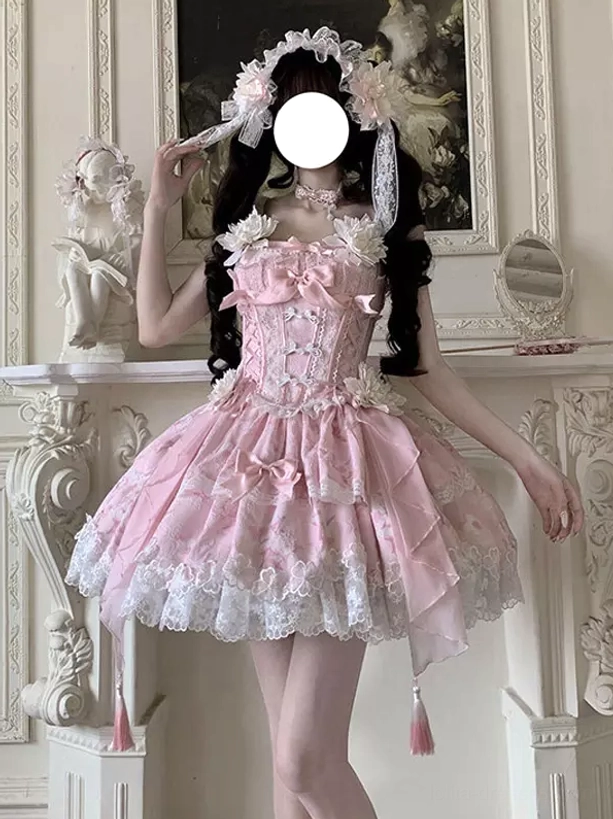 Pink sweet lolita fairy dress front three-quarter view featuring prominent front bow white lace hem and tassel pendants