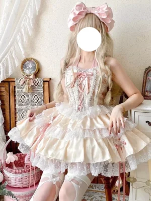 Sweet Lolita fairy dress set in pink with lace-up corset front and layered ruffled skirt - front full body view worn by blonde model with bow
