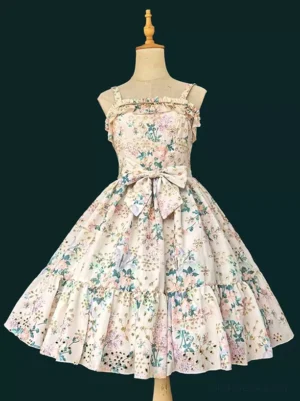 Sweet Lolita floral dress front view on dress form showing spaghetti straps sleeveless design with pink floral print pleated skirt and waist bow embellishment