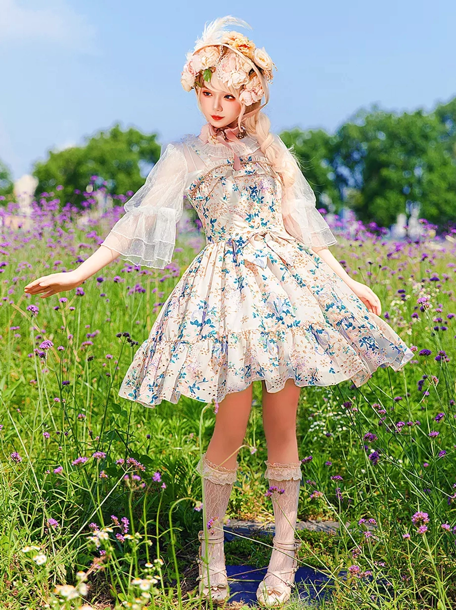 Sweet Lolita dress model front-side full-body view outdoor flower field styled with flower crown sheer bolero lace knee-high socks classic coordinate