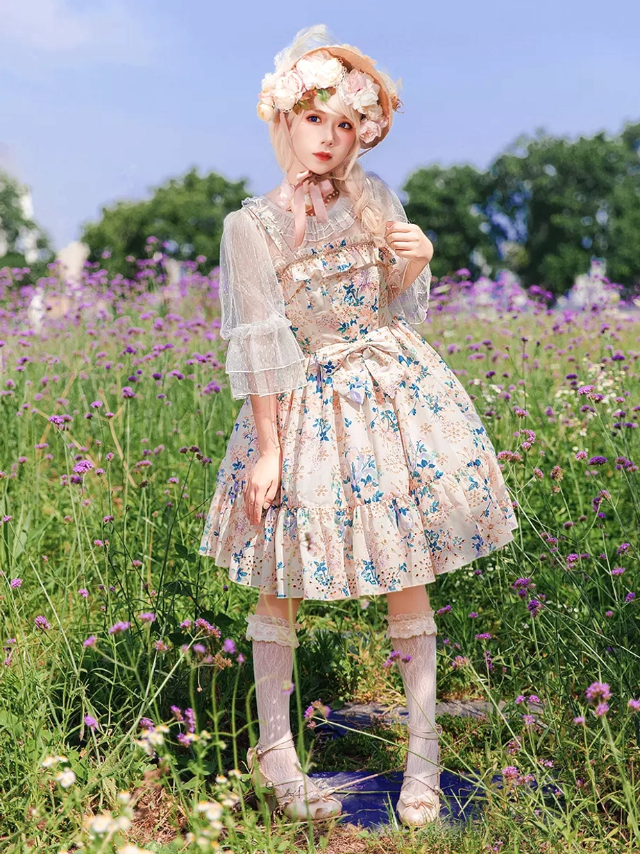 Sweet Lolita dress front full-body model view outdoor flower field scene styled with sheer short sleeves flower hair decor white socks traditional lolita
