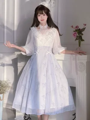Sweet lolita floral midi dress with sheer 3/4 puffed sleeves front three-quarter view on model with vintage fireplace backdrop