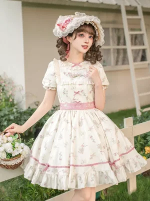 Sweet lolita floral print mini dress front three-quarter view outdoor garden setting cream base pink florals ruffle collar puffy skirt