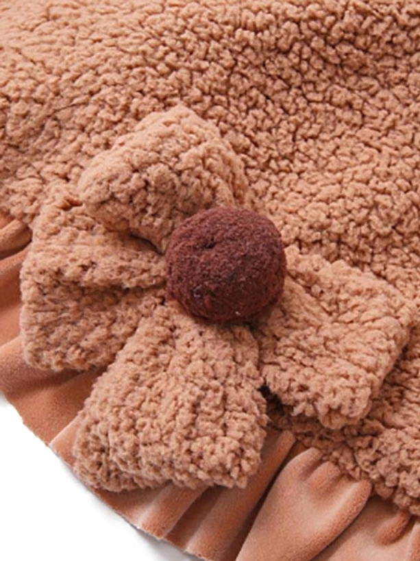 Sweet lolita fuzzy coat sherpa fleece texture close-up macro shot coffee brown fabric with decorative flower and button detail